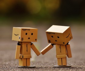 Hand in hand carton Stock Photo