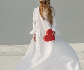 Heart-shaped girl in hand Stock Photo