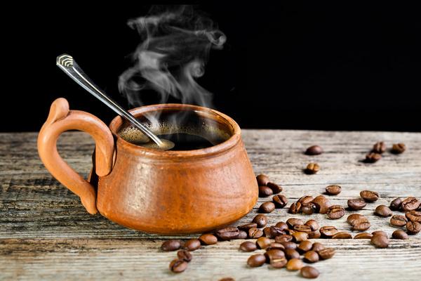 Hot coffee with coffee beans Stock Photo