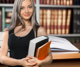 Library Young girl embracing books HD picture