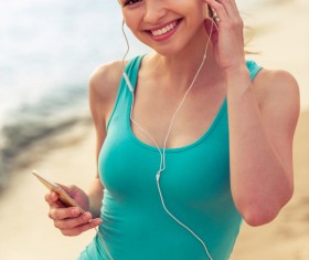 Listening to music Smiling woman Stock Photo