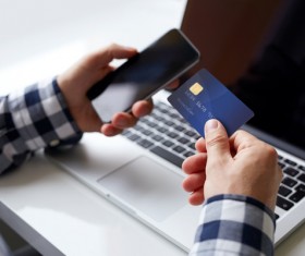 Mobile phone bank card and computer Stock Photo