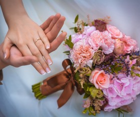 Newly married couple hand bouquet Stock Photo