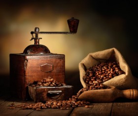 Old coffee grinder with coffee beans Stock Photo