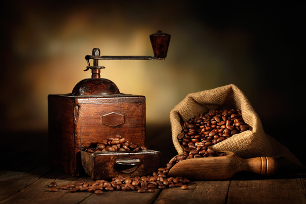 Old coffee grinder with coffee beans Stock Photo