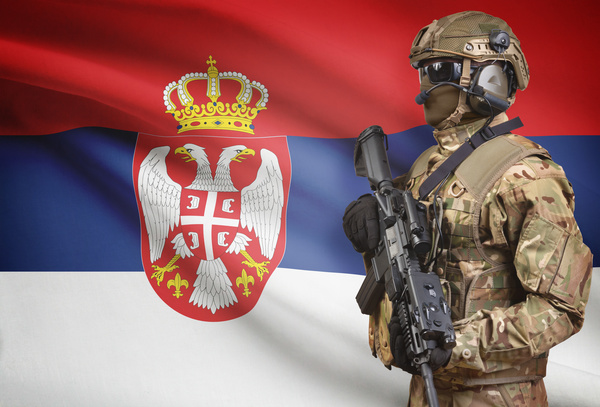 Serbian flag with heavily armed soldiers HD picture