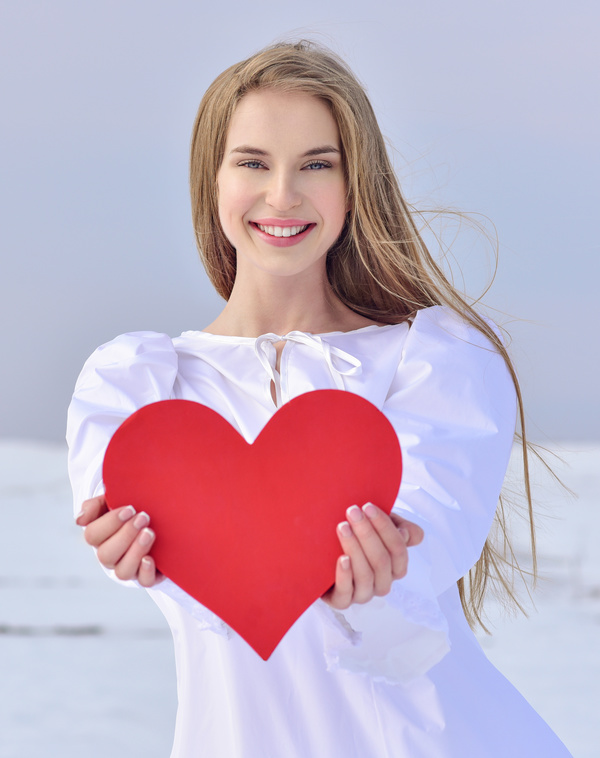 Smiling girl heart-shaped Stock Photo