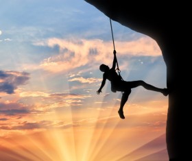 Sunset rock climbing Stock Photo