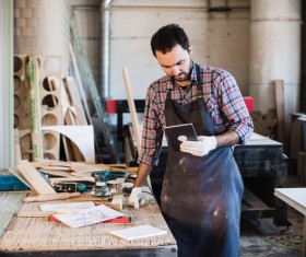 Tablet PC Information Carpenter Stock Photo