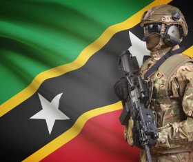 The flag of St. Kitts and Nevis and heavily armed soldiers