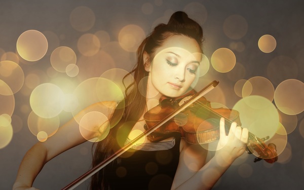 The girl playing the violin Stock Photo