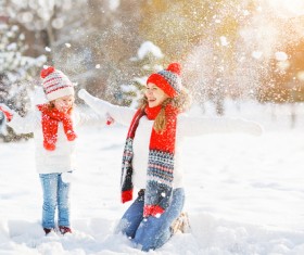 Winter Mother and daughter playing snow outdoors Stock Photo 02