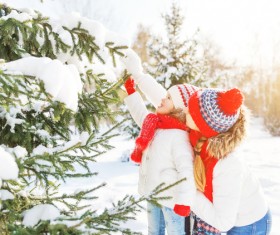 Winter Mother and daughter playing snow outdoors Stock Photo 04