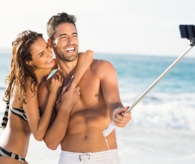 With the phone self-timer couple Stock Photo