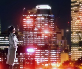 Woman looking at night city stock photo 01
