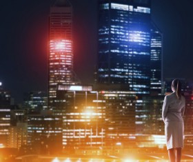 Woman looking at night city stock photo 02