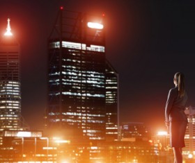 Woman looking at night city stock photo 04