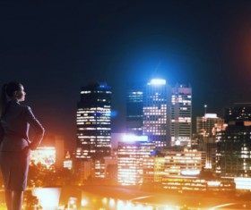 Woman looking at night city stock photo 05
