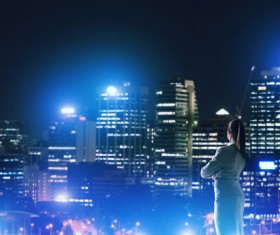 Woman looking at night city stock photo 08