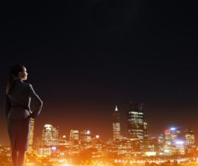 Woman looking at night city stock photo 09