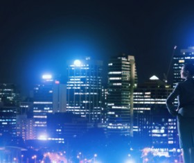 Woman looking at night city stock photo 10