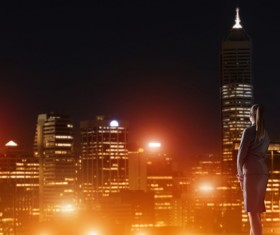 Woman looking at night city stock photo 16