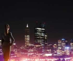 Woman looking at night city stock photo 19