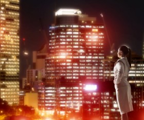 Woman looking at night city stock photo 21