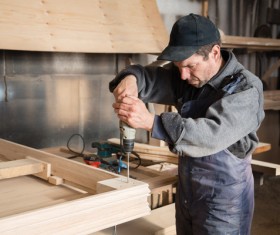 Wood frame drilling Stock Photo