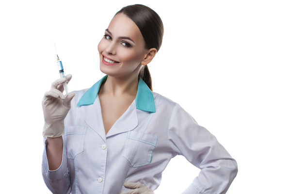 A doctor holding a needle Stock Photo