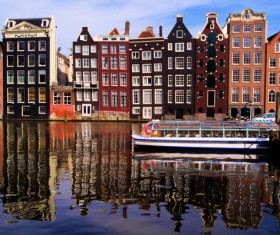 Amsterdam canals and sightseeing boats Stock Photo