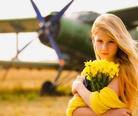 Bouquet of girls with old-fashioned airplane Stock Photo