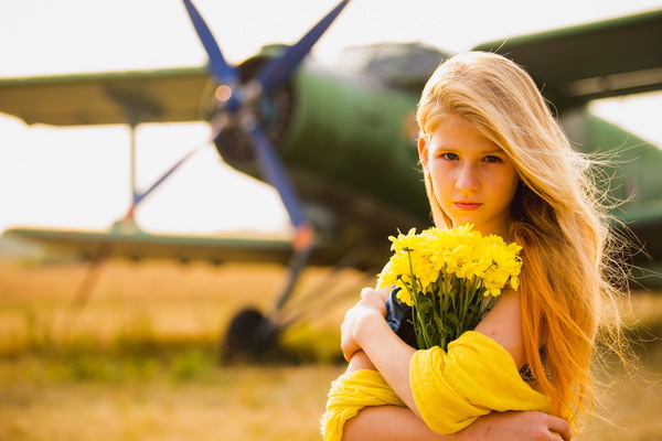 Bouquet of girls with old-fashioned airplane Stock Photo
