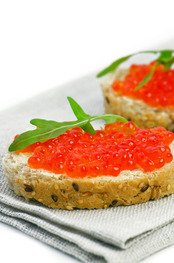 Bread slices with red caviar vegetables Stock Photo
