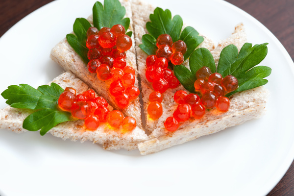Bread with red caviar Stock Photo