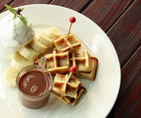 Chocolate sauce waffles with sliced bananas Stock Photo