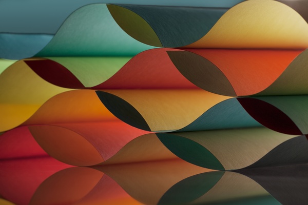 Colorful origami pattern made of curved sheets of paper 14