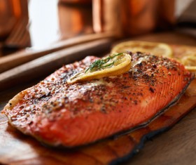 Delicious grilled salmon with lemon slices HD picture