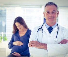 Doctor with pregnant woman Stock Photo