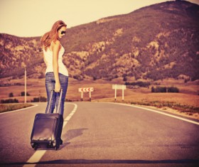 Fashion girl on the road with luggage bag HD picture