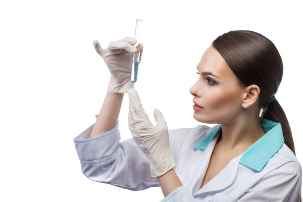 Female doctor observing the liquid Stock Photo