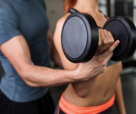 Fitness coach to guide girls fitness movements Stock Photo 04