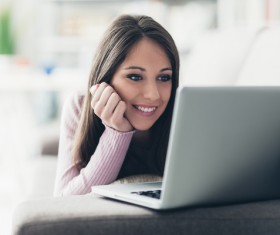 Girl watching movies on a computer HD picture