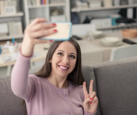 Girl with a smart phone camera HD picture