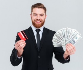 Hand holding bank card businessman, dollar bills Stock Photo