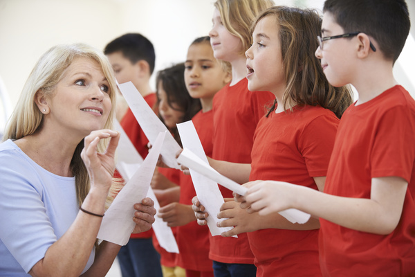 Learn to sing children and teachers Stock Photo