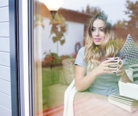 Looking out the window of the woman Stock Photo