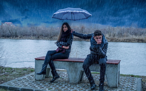 Romantic couple in the rain Stock Photo