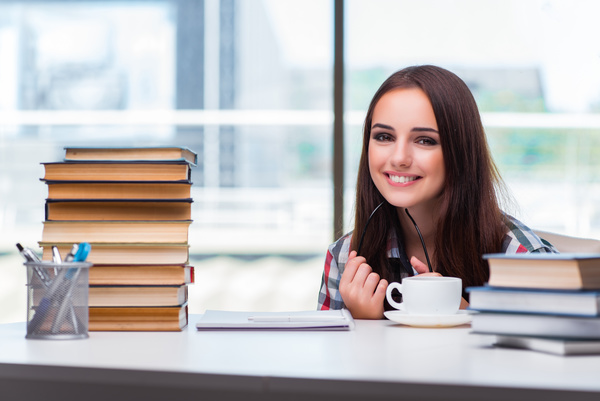 Smiling young female student and book HD picture