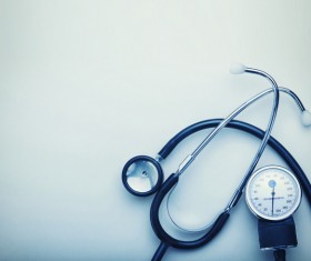 Stethoscope and blood pressure table Stock Photo